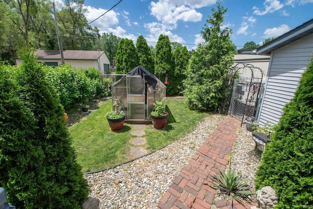 536 Garfield St, Osceola, IN 46561 - view of green lawn featuring an exterior structure and an outdoor structure