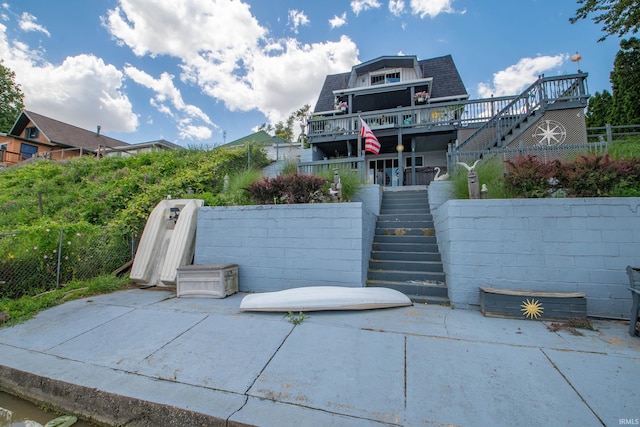 536 Garfield St, Osceola, IN 46561 - view of front of house with stairs, a patio area, and a shingled roof