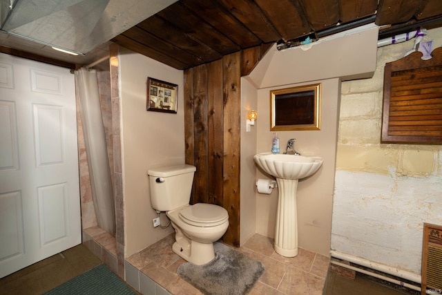 536 Garfield St, Osceola, IN 46561 - bathroom featuring toilet, tile patterned floors, and a shower with curtain
