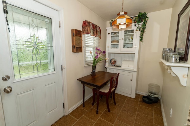 536 Garfield St, Osceola, IN 46561 - dining space with baseboards and dark tile patterned floors