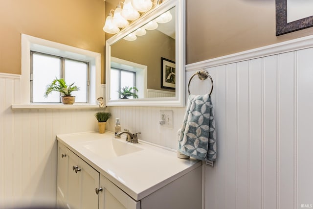 2770 S Andrews Rd, Yorktown, IN 47396 - bathroom with a wainscoted wall, vanity, and a decorative wall