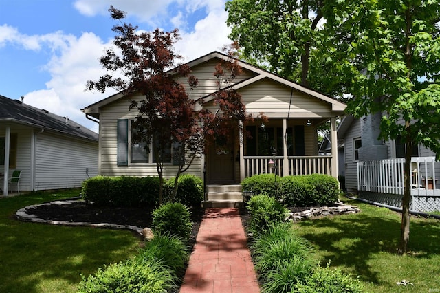 2329 Glenwood Ave, Fort Wayne, IN 46805 - view of front of property featuring covered porch and a front yard