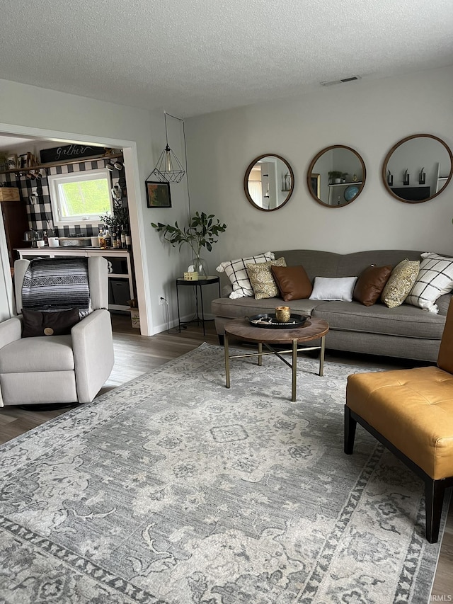 1130 Skyline Pass, Fort Wayne, IN 46825 - living room with wood finished floors and a textured ceiling