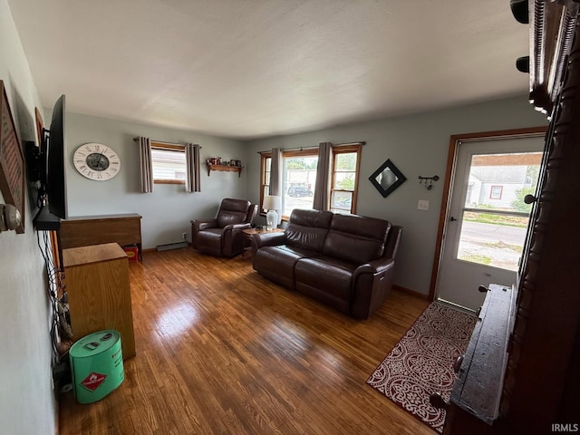 219 S 3rd St, Gas City, IN 46933 - living room with wood finished floors and baseboard heating