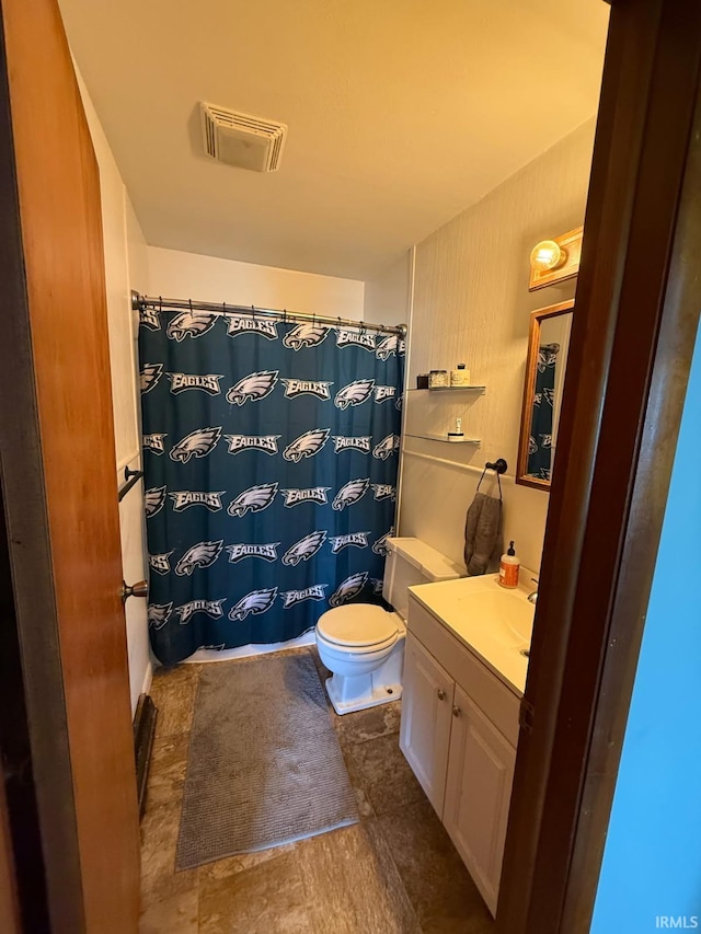 219 S 3rd St, Gas City, IN 46933 - full bathroom featuring vanity, toilet, and a shower with shower curtain