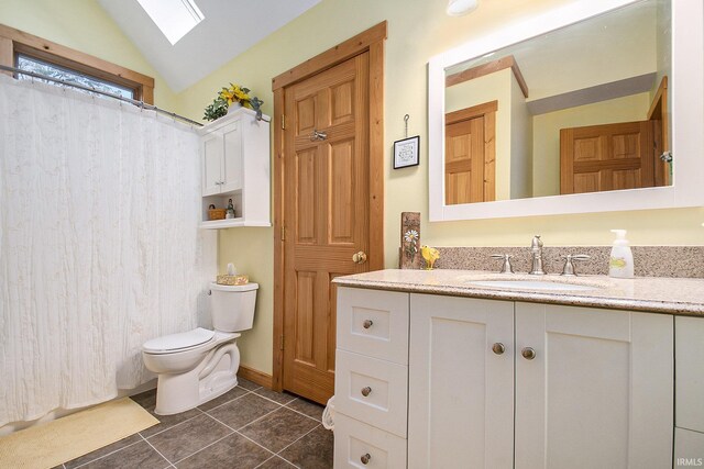 7185 N 1150 W, Shipshewana, IN 46565 - full bathroom with a skylight, lofted ceiling, vanity, toilet, and tile patterned flooring