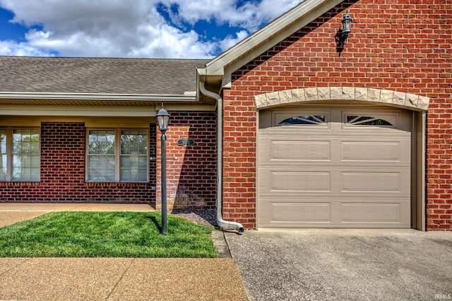 3033 Tory Ct, Evansville, IN 47715 - entrance to property featuring brick siding, a garage, a shingled roof, and driveway