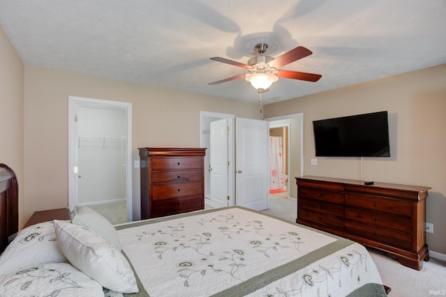 3033 Tory Ct, Evansville, IN 47715 - bedroom featuring carpet flooring, a walk in closet, baseboards, a closet, and ceiling fan