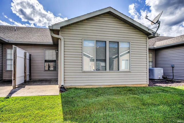 3033 Tory Ct, Evansville, IN 47715 - rear view of property with a patio area, a lawn, and a shingled roof