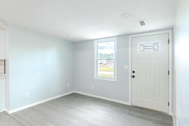 4280 S 1170 E, Lagrange, IN 46761 - foyer with wood finished floors, a textured ceiling, and baseboards