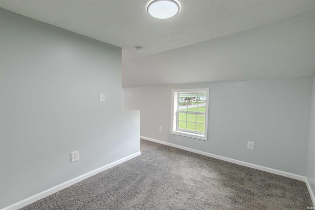 4280 S 1170 E, Lagrange, IN 46761 - empty room featuring baseboards, carpet, vaulted ceiling, and a smoke detector