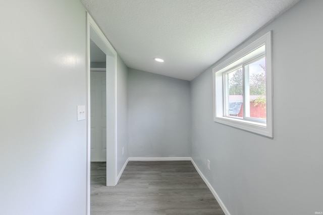4280 S 1170 E, Lagrange, IN 46761 - empty room with wood finished floors, a textured ceiling, baseboards, and recessed lighting