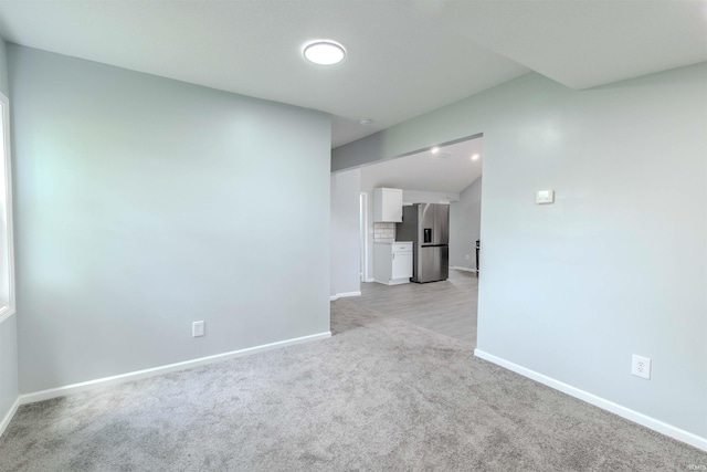 4280 S 1170 E, Lagrange, IN 46761 - unfurnished living room with baseboards and light colored carpet