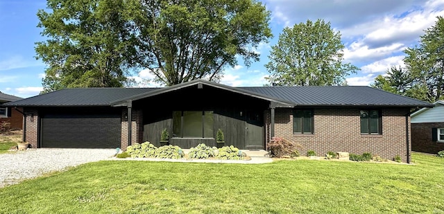 618 N Kluemper Rd, Jasper, IN 47546 - view of front of home with brick siding, driveway, and an attached garage