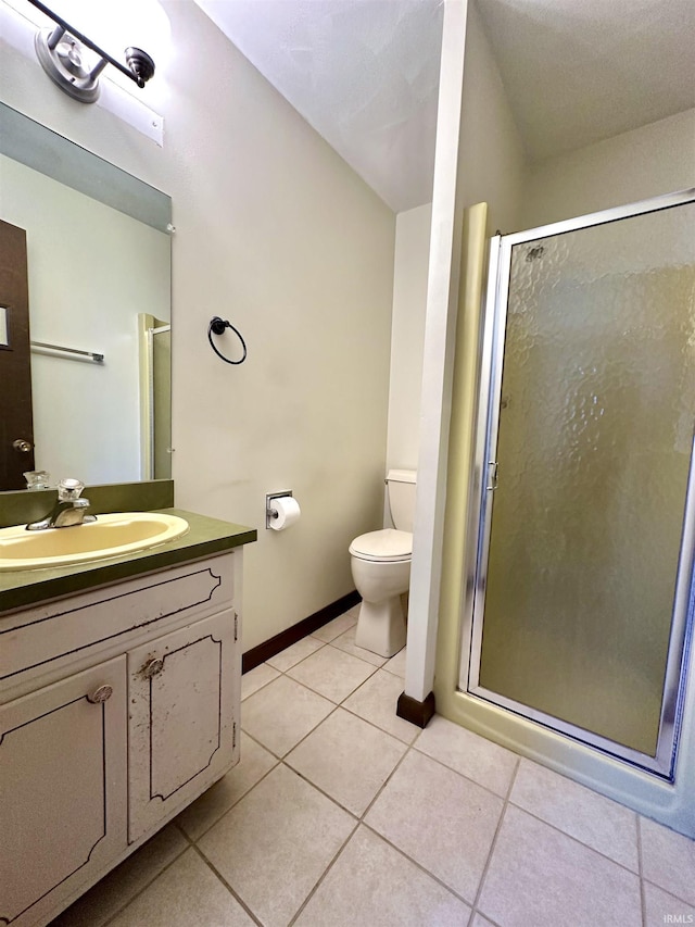 618 N Kluemper Rd, Jasper, IN 47546 - bathroom featuring toilet, vanity, a shower stall, and tile patterned flooring