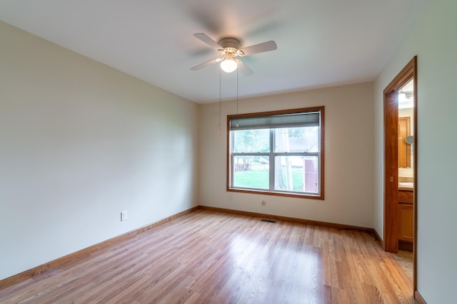 3775 W Columbia St, Columbia City, IN 46725 - spare room featuring light wood-style floors, baseboards, and ceiling fan
