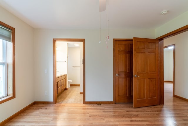3775 W Columbia St, Columbia City, IN 46725 - unfurnished bedroom featuring multiple windows, light wood finished floors, and baseboards