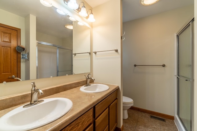 3775 W Columbia St, Columbia City, IN 46725 - full bathroom featuring a shower stall, double vanity, toilet, and baseboards