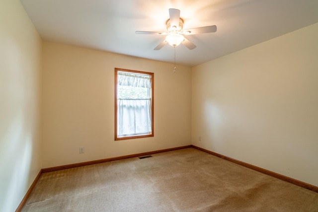 3775 W Columbia St, Columbia City, IN 46725 - spare room with carpet, a ceiling fan, and baseboards