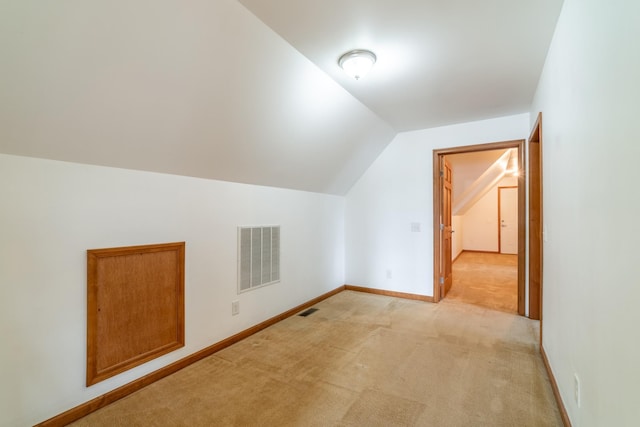 3775 W Columbia St, Columbia City, IN 46725 - additional living space featuring vaulted ceiling, light carpet, and baseboards