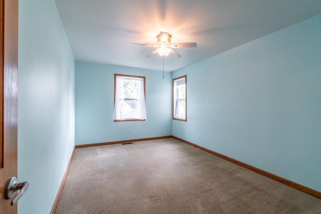 3775 W Columbia St, Columbia City, IN 46725 - spare room featuring ceiling fan, light colored carpet, and baseboards