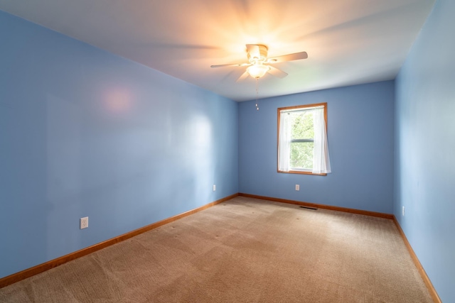 3775 W Columbia St, Columbia City, IN 46725 - spare room with light carpet, ceiling fan, and baseboards