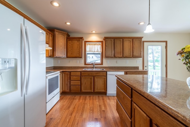 3775 W Columbia St, Columbia City, IN 46725 - kitchen featuring white appliances, a sink, brown cabinets, plenty of natural light, and recessed lighting