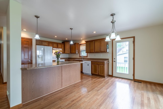 3775 W Columbia St, Columbia City, IN 46725 - kitchen with white appliances, a sink, light wood-style flooring, hanging light fixtures, and recessed lighting