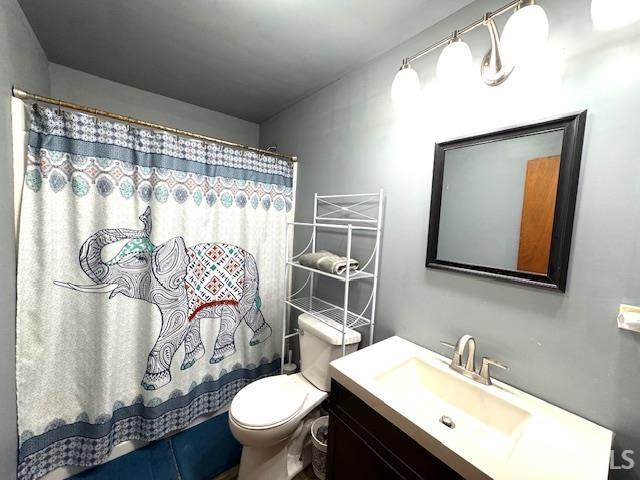 1505 S 3rd St, Clinton, IN 47842 - full bath with vanity, toilet, and curtained shower