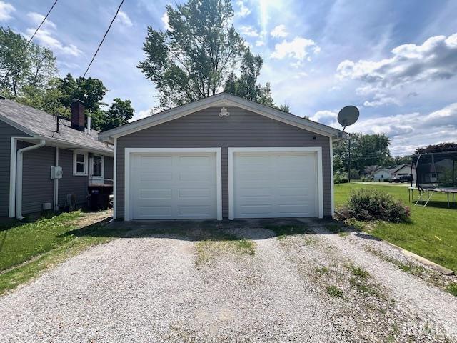 1505 S 3rd St, Clinton, IN 47842 - detached garage featuring a trampoline