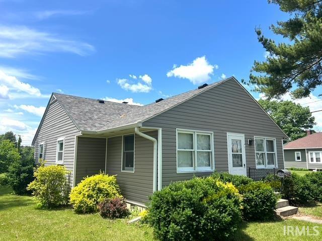 1505 S 3rd St, Clinton, IN 47842 - back of house with a lawn and roof with shingles
