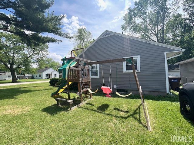 1505 S 3rd St, Clinton, IN 47842 - back of property featuring a lawn and a playground