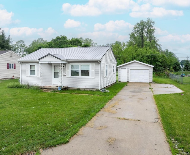 830 Linlawn Dr, Wabash, IN 46992 - view of front facade with a detached garage, an outdoor structure, metal roof, and concrete driveway