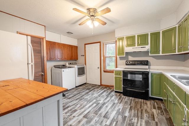 830 Linlawn Dr, Wabash, IN 46992 - kitchen featuring electric range oven, under cabinet range hood, green cabinets, freestanding refrigerator, and independent washer and dryer