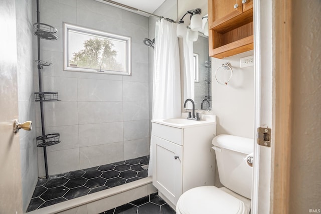 830 Linlawn Dr, Wabash, IN 46992 - bathroom with toilet, a tile shower, vanity, and tile patterned flooring