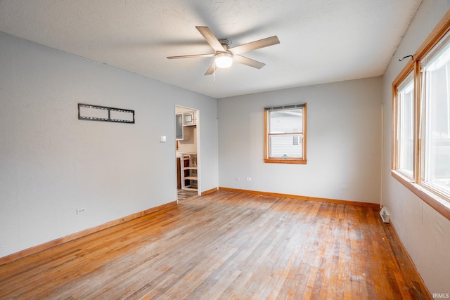 830 Linlawn Dr, Wabash, IN 46992 - spare room featuring light wood-style flooring, ceiling fan, and baseboards