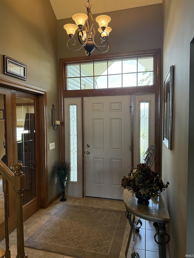 10123 Consta Verde Commons, Leo, IN 46765 - entryway with a chandelier, tile patterned flooring, and high vaulted ceiling