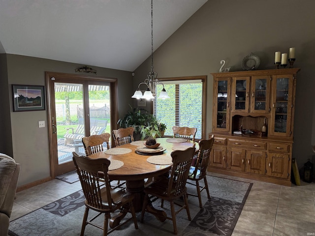 10123 Consta Verde Commons, Leo, IN 46765 - dining room featuring a chandelier, light tile patterned floors, high vaulted ceiling, and baseboards