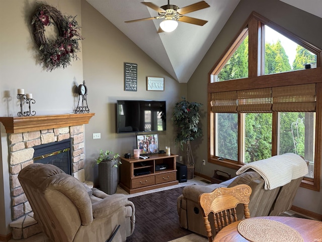 10123 Consta Verde Commons, Leo, IN 46765 - living room featuring baseboards, ceiling fan, a stone fireplace, and high vaulted ceiling