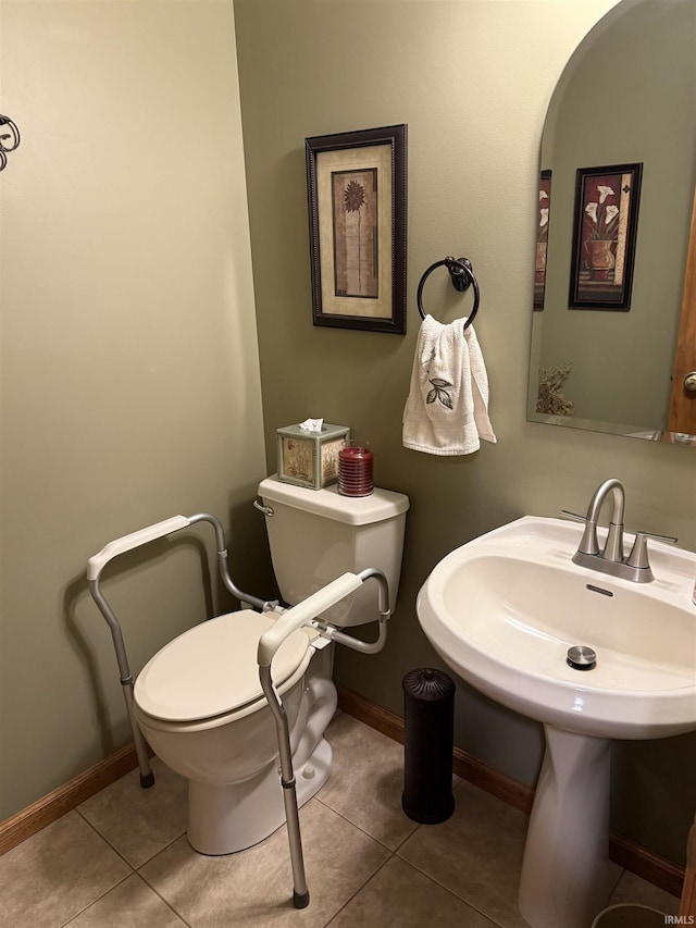 10123 Consta Verde Commons, Leo, IN 46765 - bathroom featuring toilet, tile patterned flooring, baseboards, and a sink