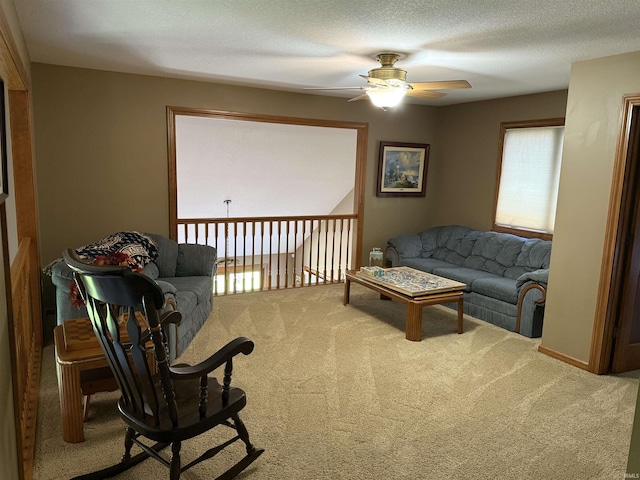 10123 Consta Verde Commons, Leo, IN 46765 - carpeted living room featuring a ceiling fan and a textured ceiling