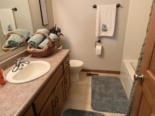10123 Consta Verde Commons, Leo, IN 46765 - full bathroom with vanity, tile patterned floors, toilet, and baseboards