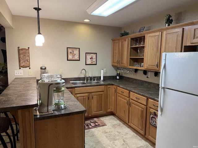 10123 Consta Verde Commons, Leo, IN 46765 - kitchen featuring freestanding refrigerator, a sink, a peninsula, dark countertops, and open shelves