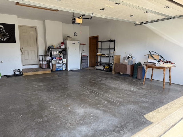 10123 Consta Verde Commons, Leo, IN 46765 - garage featuring freestanding refrigerator and a garage door opener