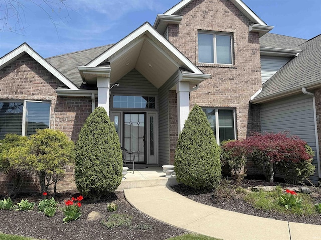 10123 Consta Verde Commons, Leo, IN 46765 - property entrance with a shingled roof and brick siding