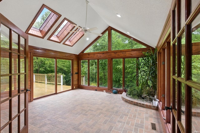 2814 Meadow Strm, Fort Wayne, IN 46825 - unfurnished sunroom with a skylight, lofted ceiling, and healthy amount of natural light