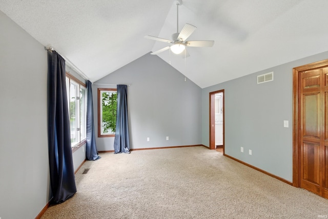 2814 Meadow Strm, Fort Wayne, IN 46825 - carpeted spare room with ceiling fan, vaulted ceiling, and baseboards