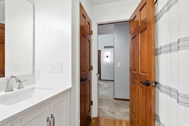 2814 Meadow Strm, Fort Wayne, IN 46825 - full bathroom featuring vanity and wood finished floors