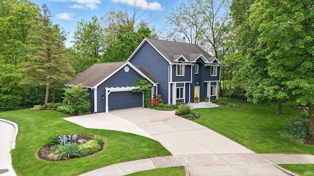 2814 Meadow Strm, Fort Wayne, IN 46825 - view of front facade featuring concrete driveway, an attached garage, and a front lawn