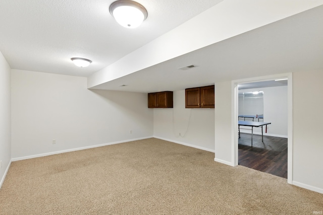 2814 Meadow Strm, Fort Wayne, IN 46825 - finished basement featuring dark colored carpet and baseboards